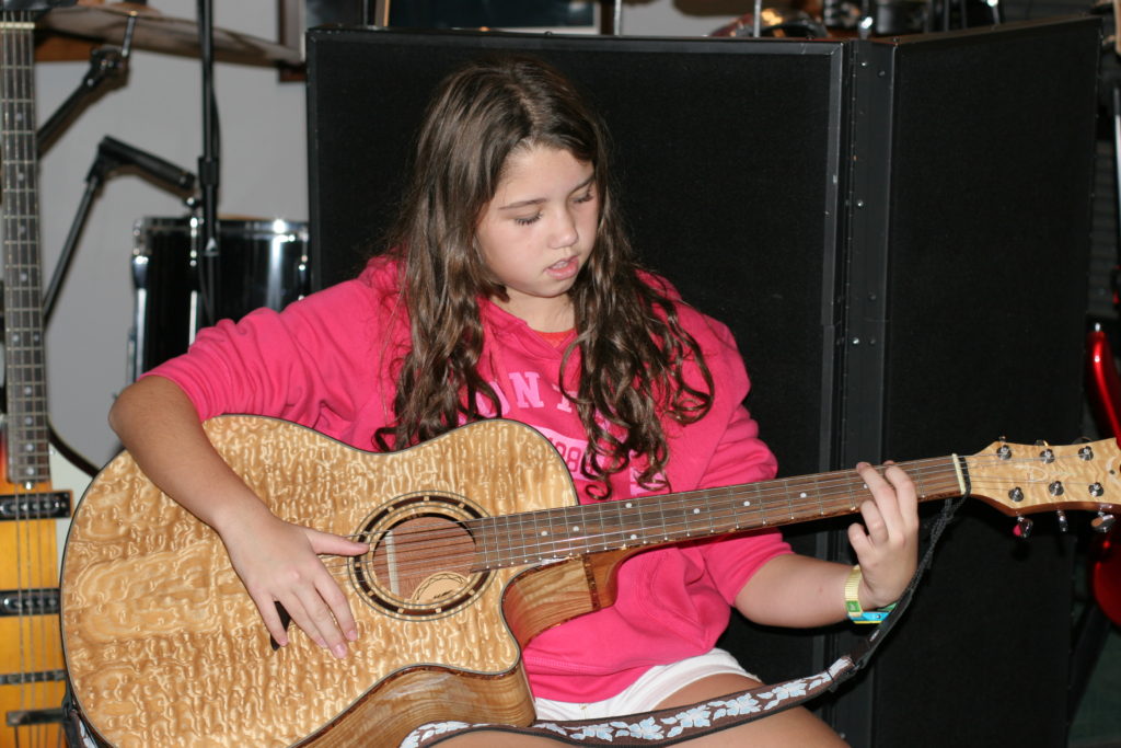 Girl playing guitar